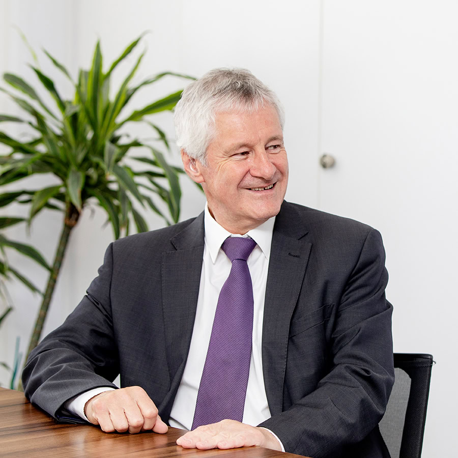 Glyn Thomas headshot in office