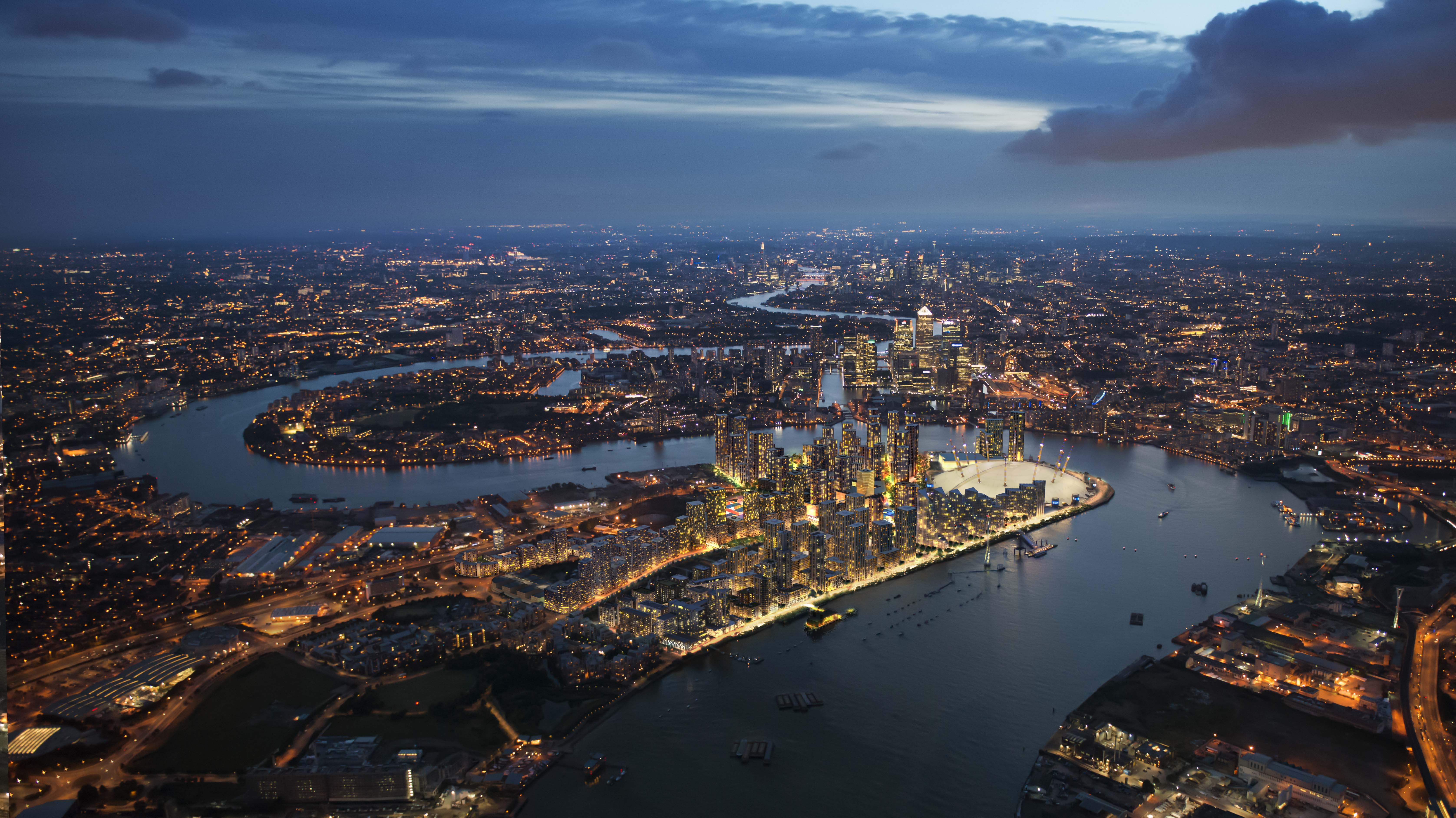 A night birds eye view of Greenwhich with all the buildings lighten up and the River Thames.