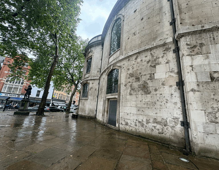 Image of exterior of St Clement Dane church showing damage from gunfire in the Second World War