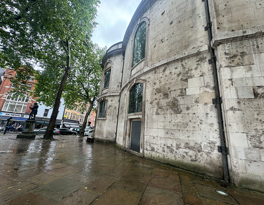 Image of exterior of St Clement Dane church showing damage from gunfire in the Second World War