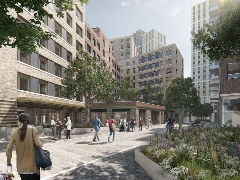 Alt text: A diverse group of people walking along a busy city street, surrounded by tall buildings and greenery. The sky is partly cloudy, and pedestrians are dressed in casual clothing and footwear, engaging in outdoor activities in an urban area.