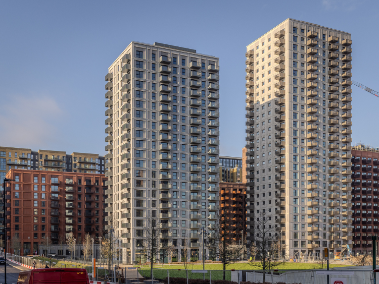 Residential buildings and a large pond at Wembley Park.