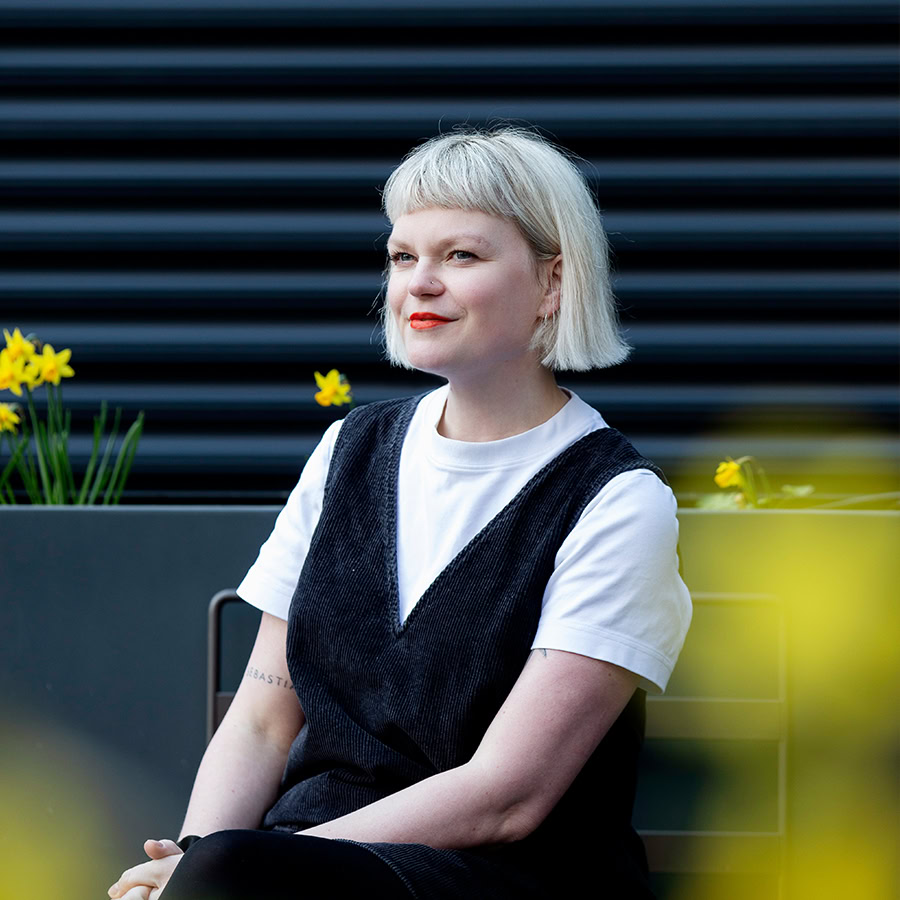 photograph of Kelly Scott outside the office.