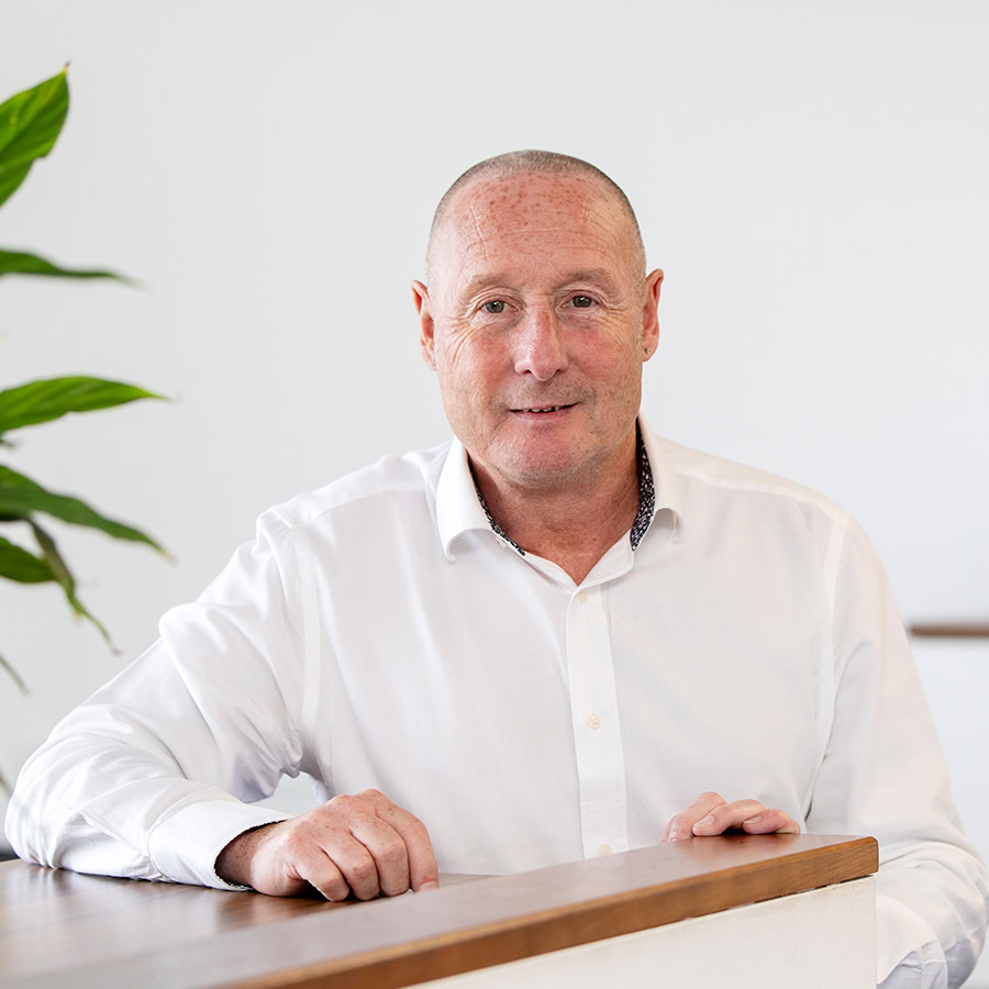 Mick Whiteaway headshot inside the office