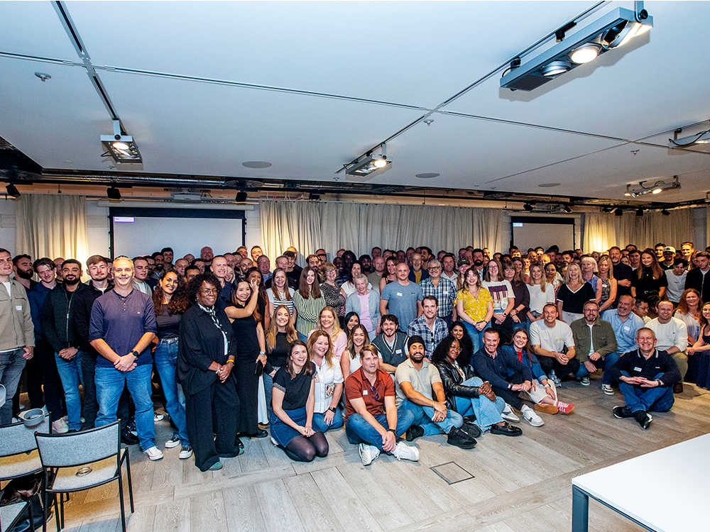Large group of people sitting in conference room
