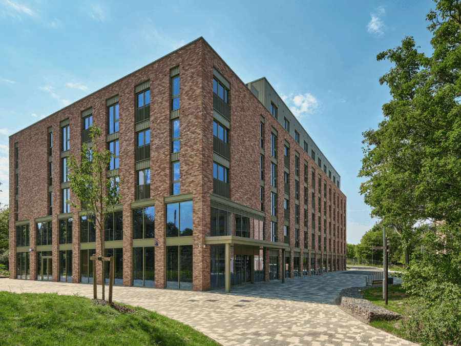 Outside of 120 Longwood Close's student accommodation building with large windows and landscaped surroundings.