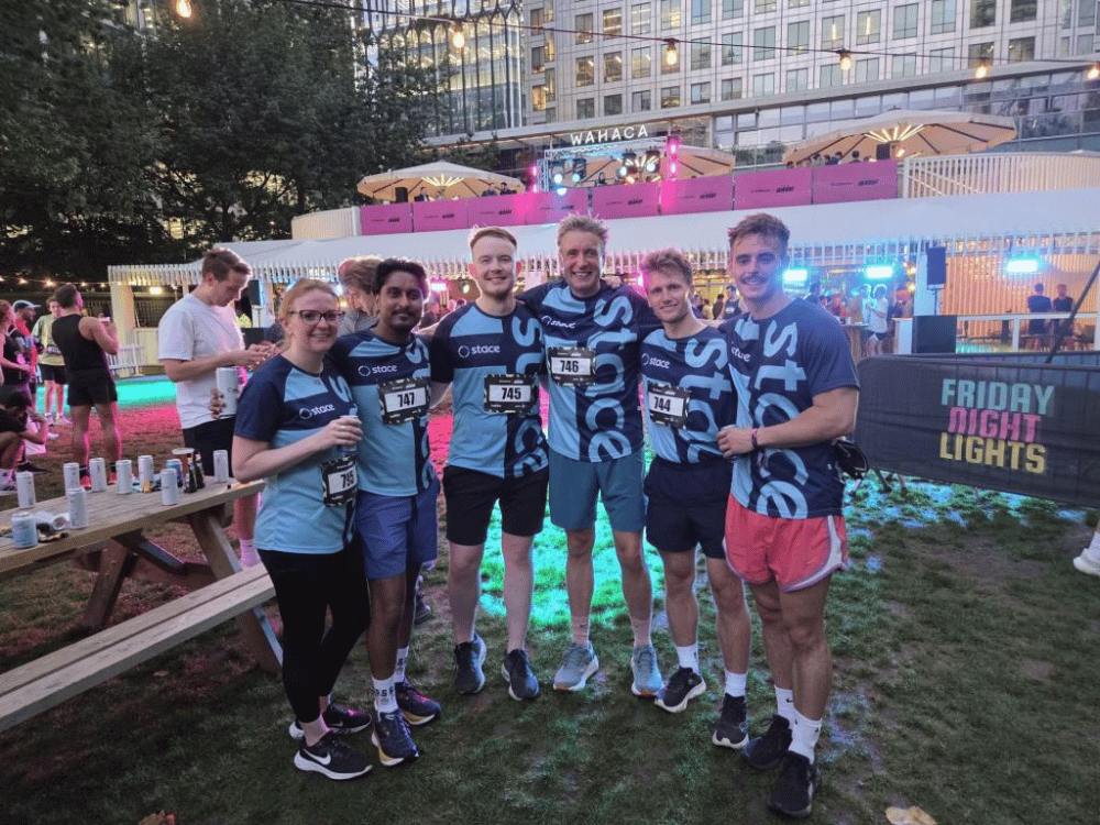Photograph of men and woman from Stace team after they completed a 5K run.